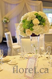 white_green_tall_wedding_centerpiece